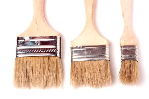 Three different size paint brushes isolated on white background Stock Photos