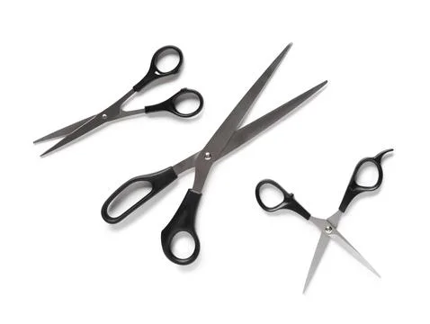 Three different sized scissors with black handles, metal blades, and sharp ed Stock Photos