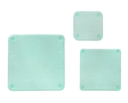Three different sized silicone square stretch lids insulated on white backgro Stock Photos