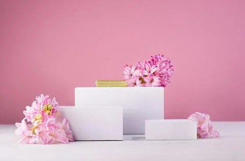 Three different square white podiums for display cosmetic produce or goods wi Stock Photos