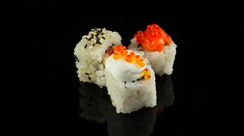 Three different sushi on black background rotating (loop) 스톡 동영상 55641122