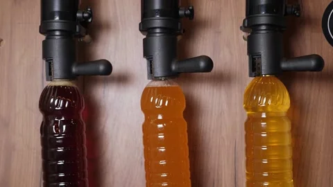 Three different types of beer are bottled in disposable bottles. Vídeo Stock 345132227