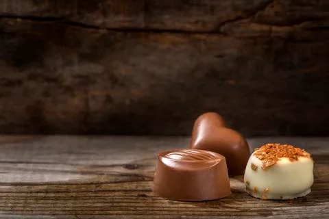 Three different types of chocolate candy on wood Stock Photos