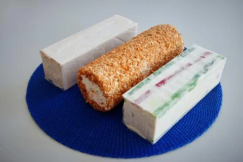 Three different types of desserts are on a blue plate Stock Photos
