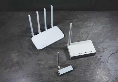 Three different types of Wi-Fi routers, modern and old technology. Wireless.. Stock Photos