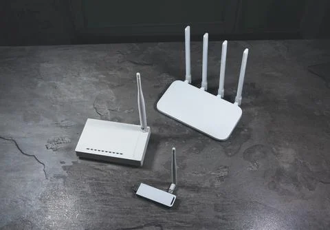Three different types of Wi-Fi routers, modern and old technology. Wireless.. Stock Photos
