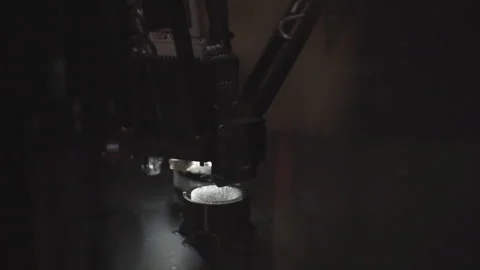 Three-dimensional 3D printer makes a plastic figure. Stock Footage 120610748