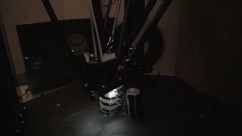 Three-dimensional 3D printer makes a plastic figure. 3D printer with backlight. Stock Footage 120688014