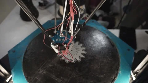 Three-dimensional 3D printer makes drawing on a flat surface. View from above. Stock Footage 120688191