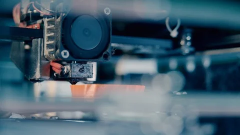 Three dimensional 3d printer working at 3d printing lab. Head of a 3D-printer at Stock Footage 124203053