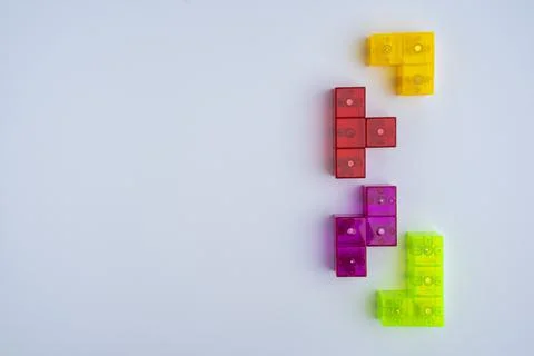 Three-dimensional colored tetris figures on a white background, space for cop Stock-Fotos
