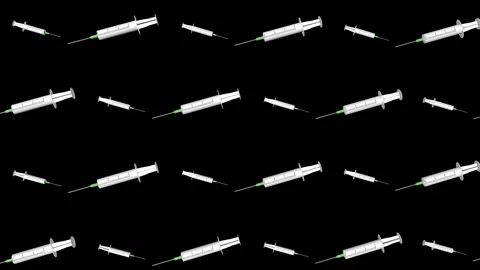 A three-dimensional model of a disposable syringe rotates on a black background. 스톡 동영상 146917891
