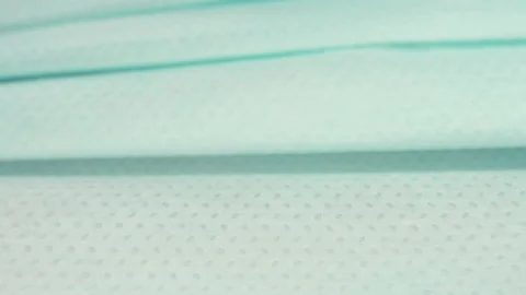 Three-dimensional non-woven mask, close up video clip.4k macro detail. 動画素材 155281148