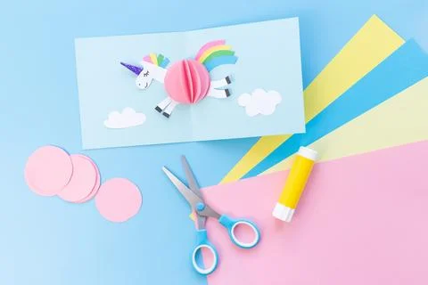 Three-dimensional paper craft featuring colorful paper elements, with sciss.. 스톡 사진