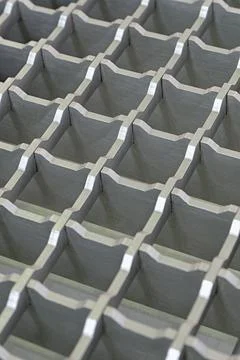 Three-dimensional steel grid with square cells, non-slip floor covering for.. Stock Photos