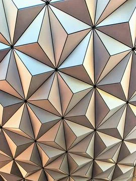 Three-dimensional triangles in repeating shapes with lights and shadows Stock Photos