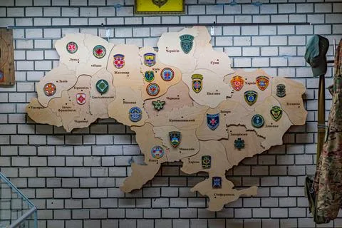 Three-dimensional wall decoration shaped like Ukraine, composed of various .. Stock Photos
