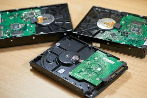 Three disassembled SATA hard disk drives Stock Photos
