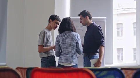 Three diverse young professionals planning work Stock Footage 105191210