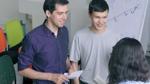 Three diverse young professionals talking during brainstorming Stock Footage 105193634