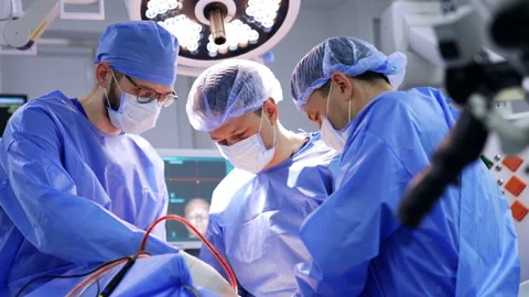 Three doctors cooperate at neurosurgery.  Stock Footage 299848856