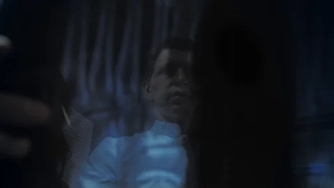 Three doctors look at an x-ray photo of a patient together Stock Footage 120651221