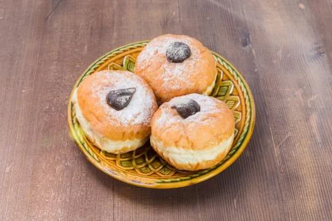 Three donuts on a plate Fotos Stock