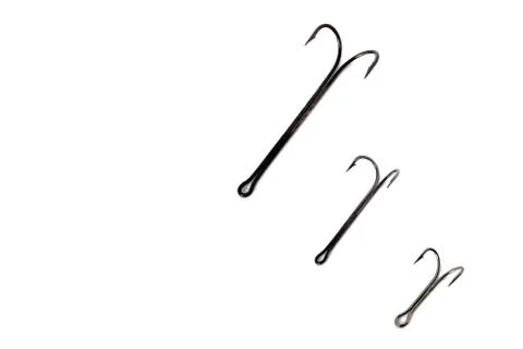 Three, double hooks of different sizes white background close-up Foto stock
