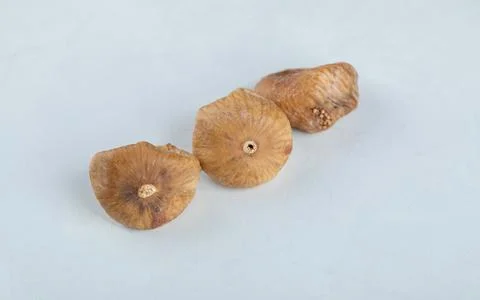 Three dried figs on white background Stock Photos