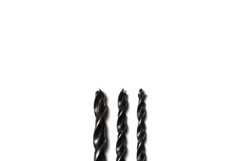 Three Drill bits for drills isolated on white background Stock Photos