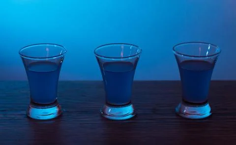 Three drinks at the party. Three shots with cocktails at the bar. Liquor, vod 스톡 사진