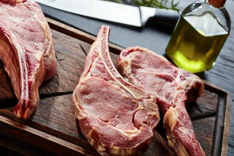 Three Dry aged raw tomahawk beef steaks Stock Photos