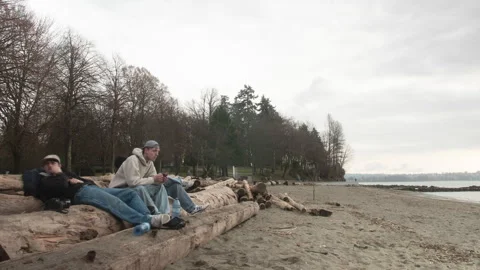 Three dudes at Third Beach in Vancouver Stock Footage 247069974