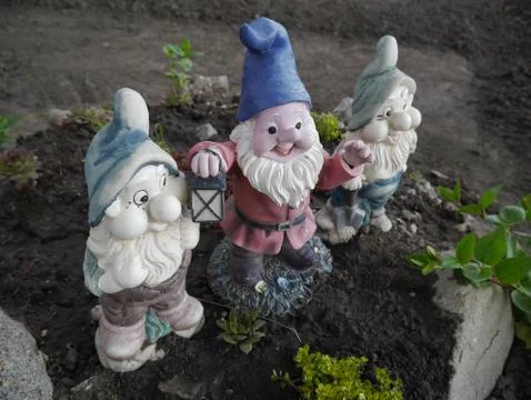 Three dwarf with lantern Stock Photos