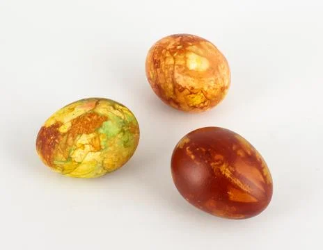 Three dyed Easter eggs isolated Stock Photos