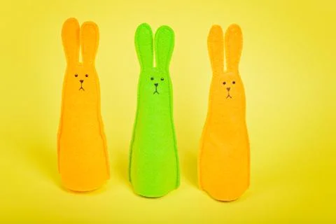 Three easter Bunnies on yellow Stock Photos