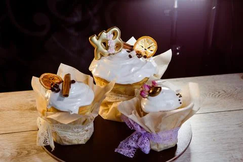 Three Easter cakes decorated with cinnamon and candied fruits Stock Photos