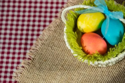 Three Easter eggs in a basket. 写真素材