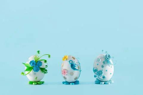 Three Easter eggs on a blue background Stock Photos