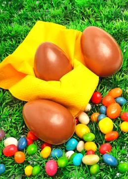Three easter eggs on the green grass Stock Photos