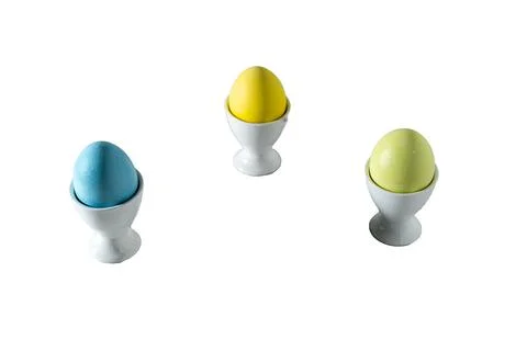 Three easter eggs in pastel colors in triangle arrangement Stock Photos