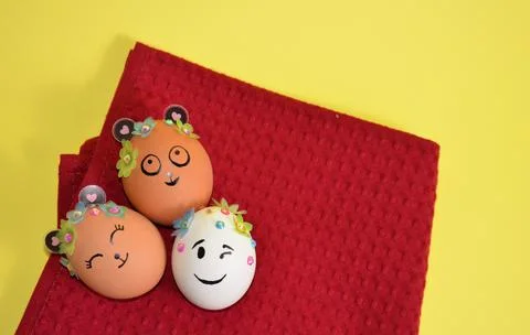 Three Easter eggs on a red napkin. Spring. Easter. Stock Photos