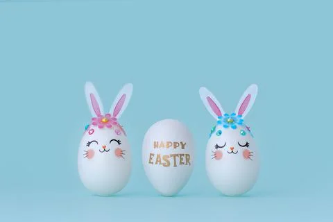 Three Easter eggs in a row on a blue background with copy space. Stock Photos