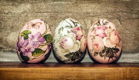 Three Easter eggs stacked on the wooden base, Easter holiday Stock Photos
