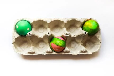 Three easter eggs in a tray placed separately Stock Photos