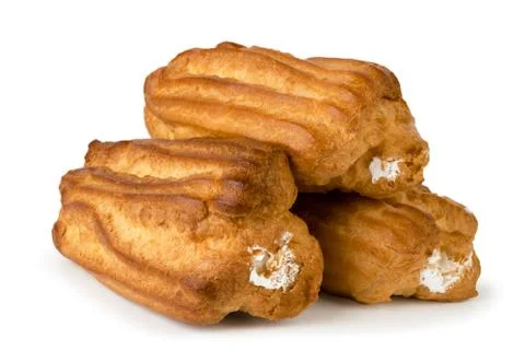 Three eclairs with cream on a white, isolated. Stock Photos