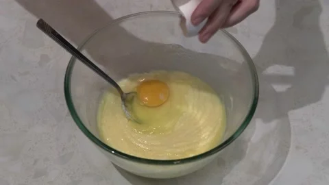 Three eggs are broken into the pie dough Stock Footage 164500807