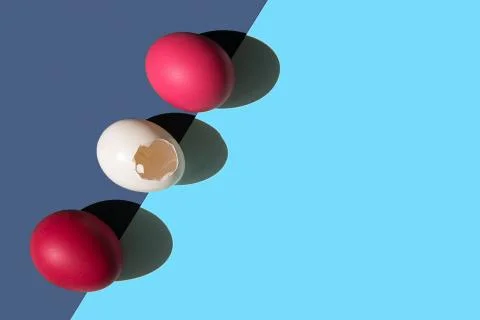 Three eggs are laid on the edge of the frame in a row. Stock Photos