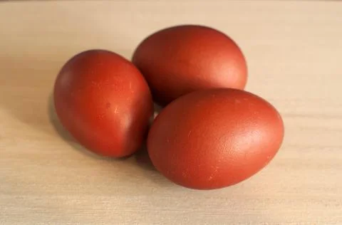 Three eggs are red. Stock Photos