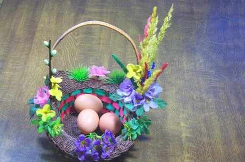 Three eggs in basket Stock Photos